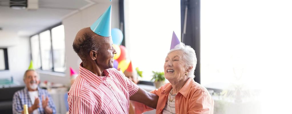 Residents celebrating at an indoor party