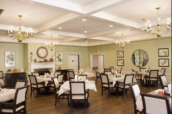 Bright and inviting dining room with tables set for meals