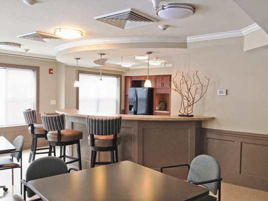 Interior view of the common area with a bar and seating