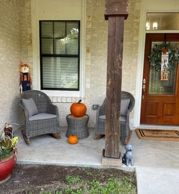 Cozy porch with seating and autumn decorations