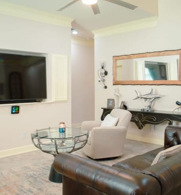 Cozy common area with comfortable seating and large TV