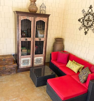 Cozy outdoor seating area with bright cushions