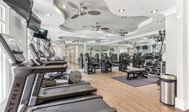 Interior view of a gym with various exercise equipment