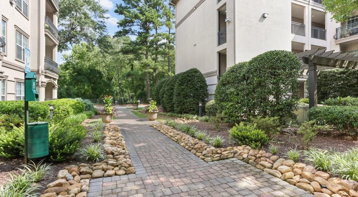 Well-maintained garden pathway leading to the facility