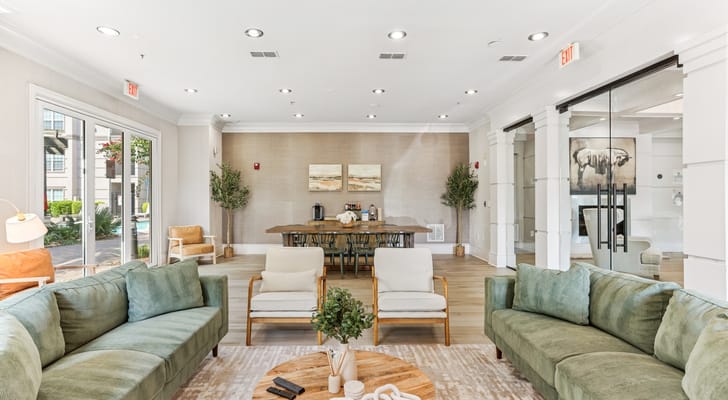 Bright common area with comfortable seating and dining table