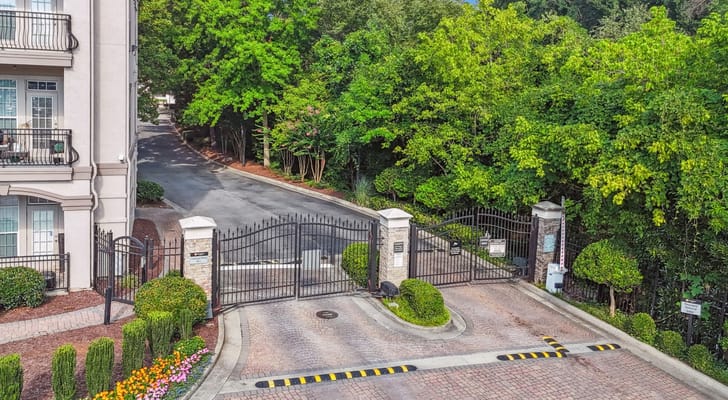 Entrance gate to Avana Uptown surrounded by greenery