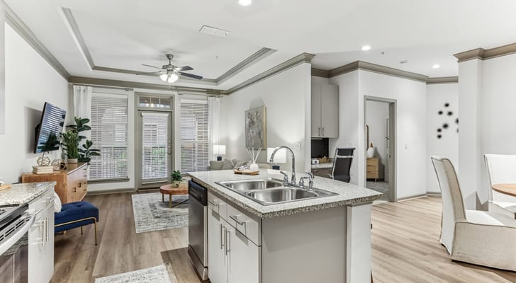 Modern interior of a resident unit featuring living area and kitchen