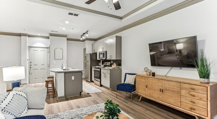 Modern interior of a senior living unit with kitchen and living area