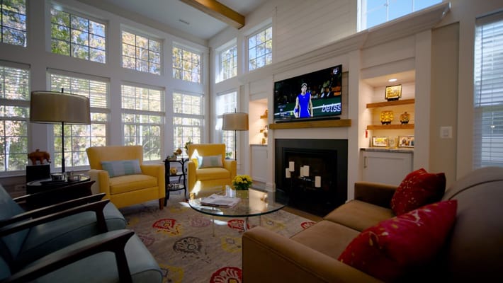 Bright common area with seating and TV