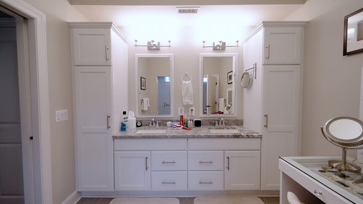 Bright bathroom with double vanity and mirrors