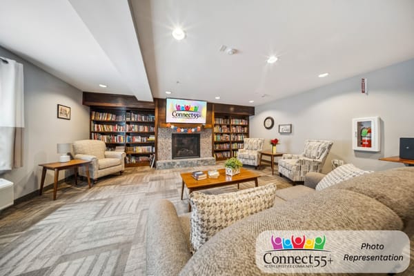 Cozy common area with bookshelves and seating
