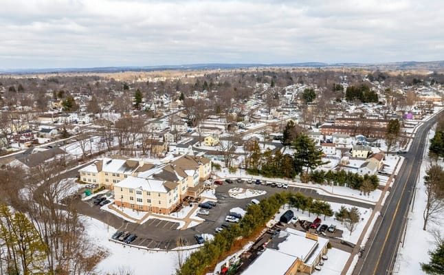 Aerial view of Krause Gardens Senior Living surrounded by snow and residential areas.