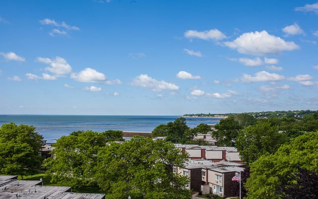 Overhead view of The Soundview senior living facility with a seaside backdrop