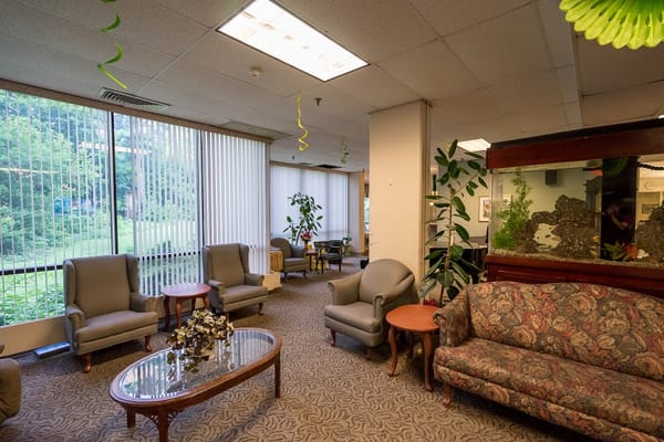 Spacious lobby with comfortable seating and an aquarium