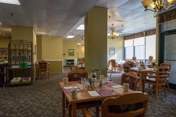 Cozy dining area with tables set for meals.