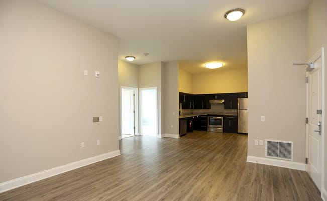 Open living area with kitchen in Linden Hill Station Apartments