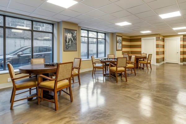 Bright common area with tables and chairs
