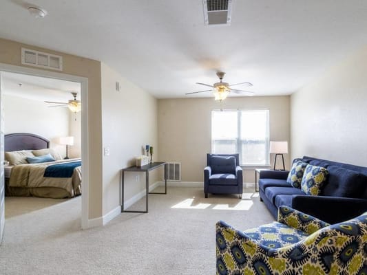 Bright interior view of a resident room with furniture