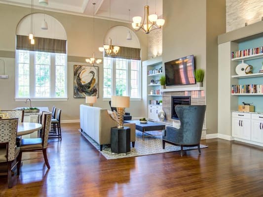 Bright common area with comfortable seating and large windows