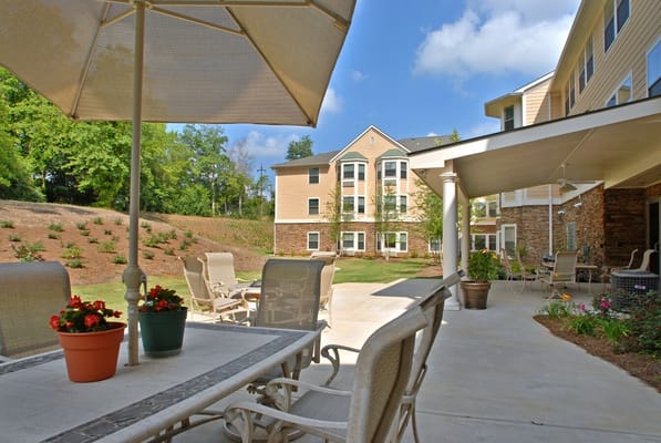 Outdoor patio area with seating and flowers