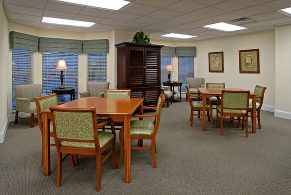 Bright common area with seating and tables