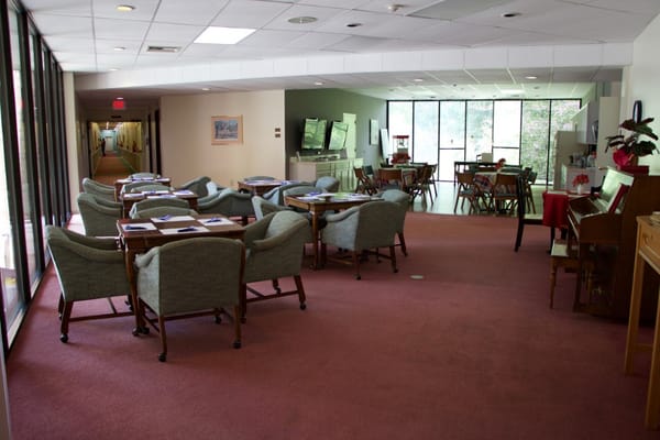 Common area with seating and tables in a facility