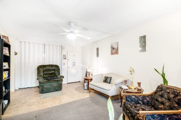 Living room with two seating areas and decorative accents