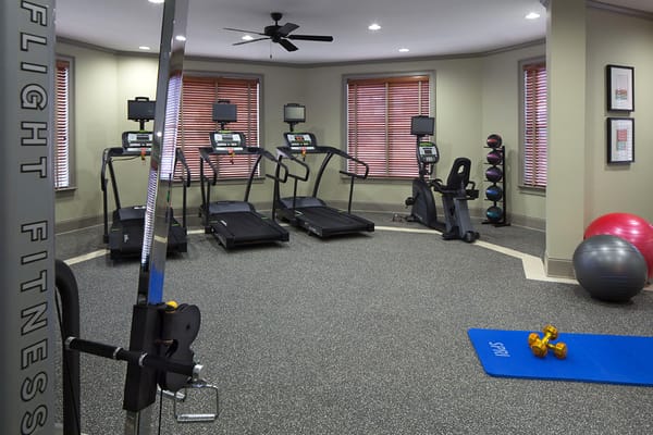 Fitness center with exercise equipment and weights