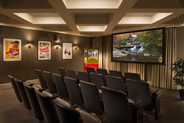 Interior of a cozy movie theater room with seating