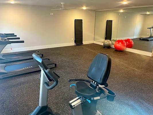 Interior view of a modern fitness room with exercise equipment