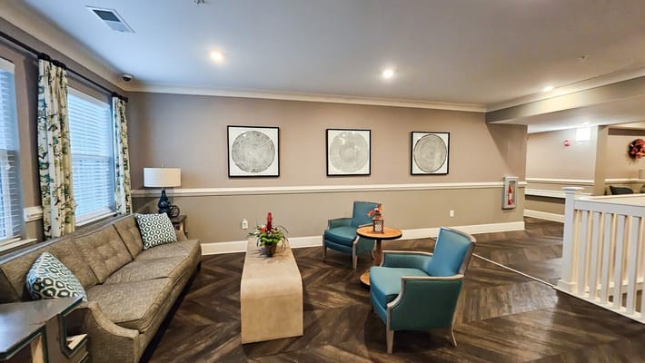 Cozy common area with seating and artwork