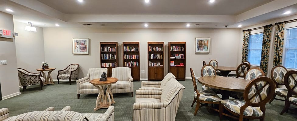 Interior common area with seating and bookshelves