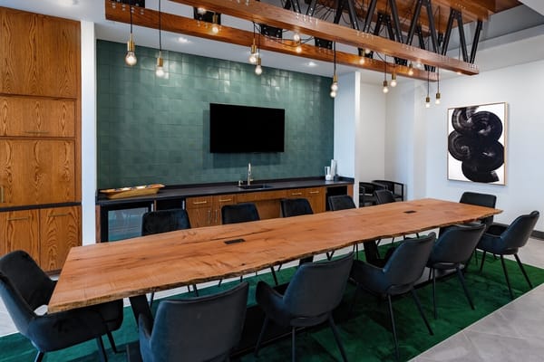 Contemporary meeting room with a long wooden table