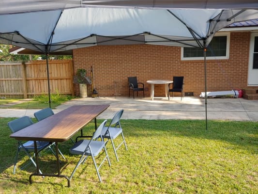 Outdoor seating area with tables and chairs