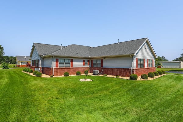 Exterior view of Springfield Gardens Inc. with manicured lawns.