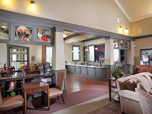 Bright and inviting living room with comfortable seating and dining area.