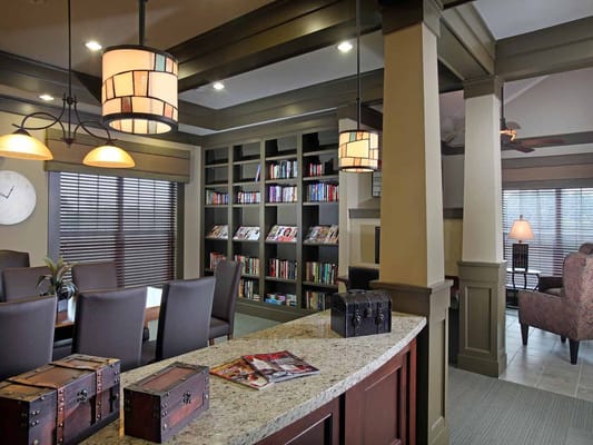 Library area featuring bookshelves and seating