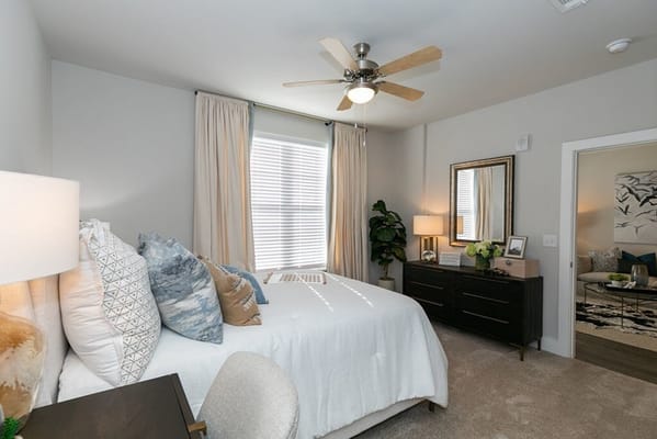 Stylish bedroom with a king-sized bed and ample natural light