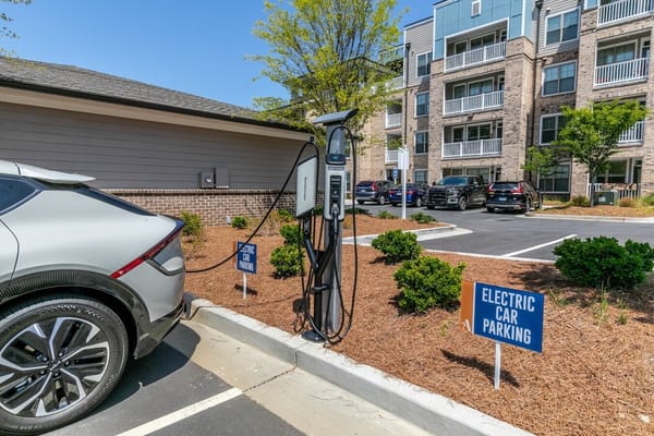 Electric vehicle charging station in parking area