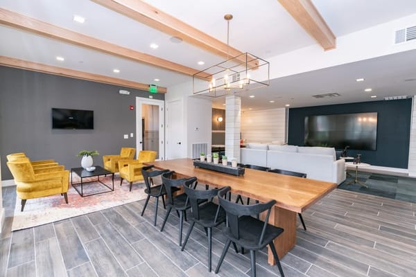Interior commons area with seating and dining table