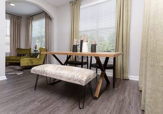 A dining area with modern furniture and decor