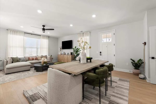 Bright common area with seating and dining space