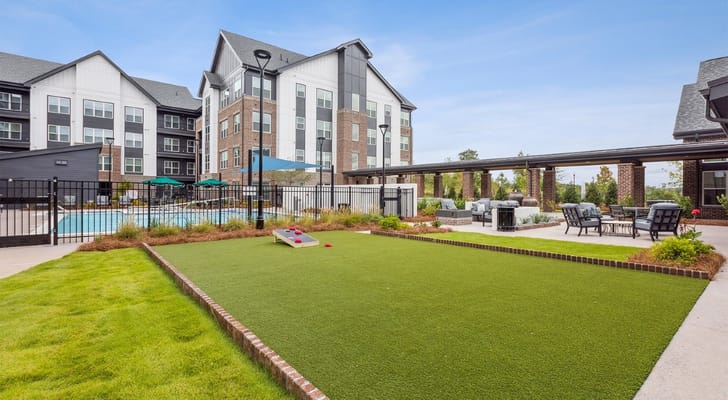Outdoor space with seating and a pool area