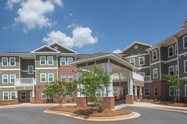 Exterior view of a senior living facility with a portico