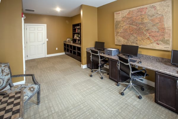 Interior common area with computers and a map on the wall
