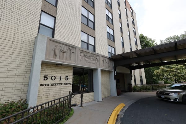 Facade of a nursing home building with entrance drive