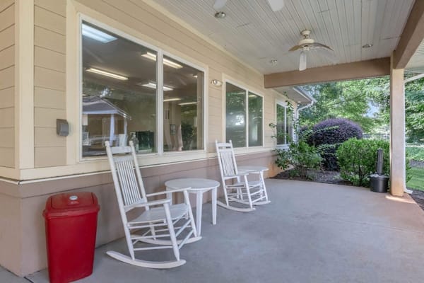 Outdoor seating area with rocking chairs