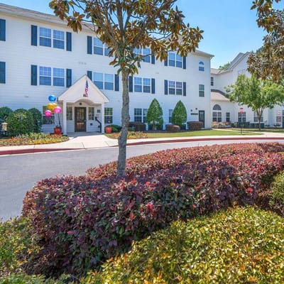 Exterior view of Ashton Arbors Senior Residences with landscaping