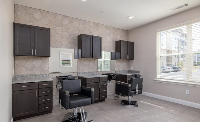 Modern beauty salon area with styling chairs