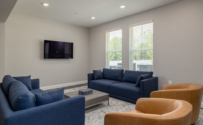 Bright common area with seating and television